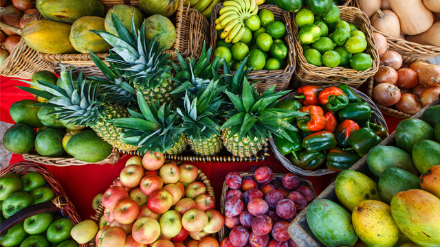 Overhead view of brightly colored fruits and vegetables at the West Palm Beach GreenMarket